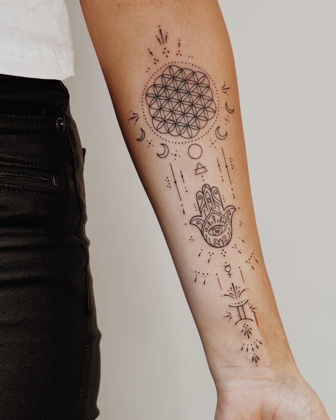 Astrologically Rich Gemini Forearm Tattoo