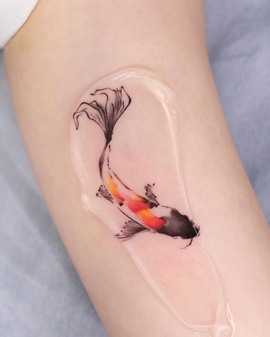 Beautiful Coy Fish Arm Tattoo