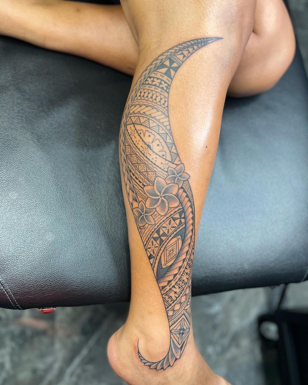 Graceful Samoan Leg Tattoo With Floral Accent