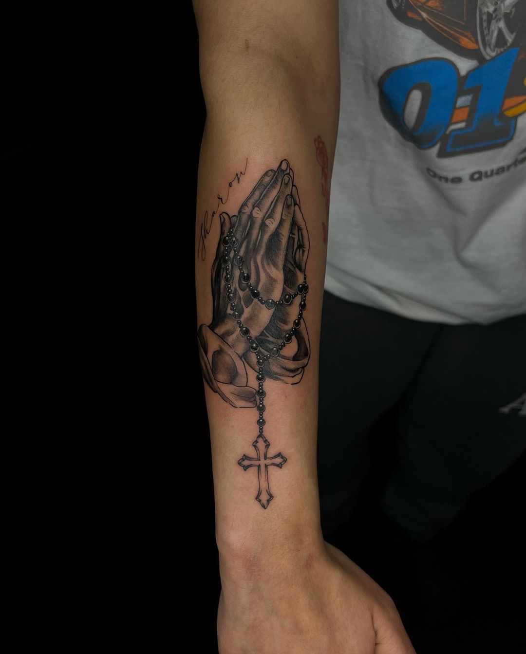 Rosary Clad Praying Hands Forearm Tattoo