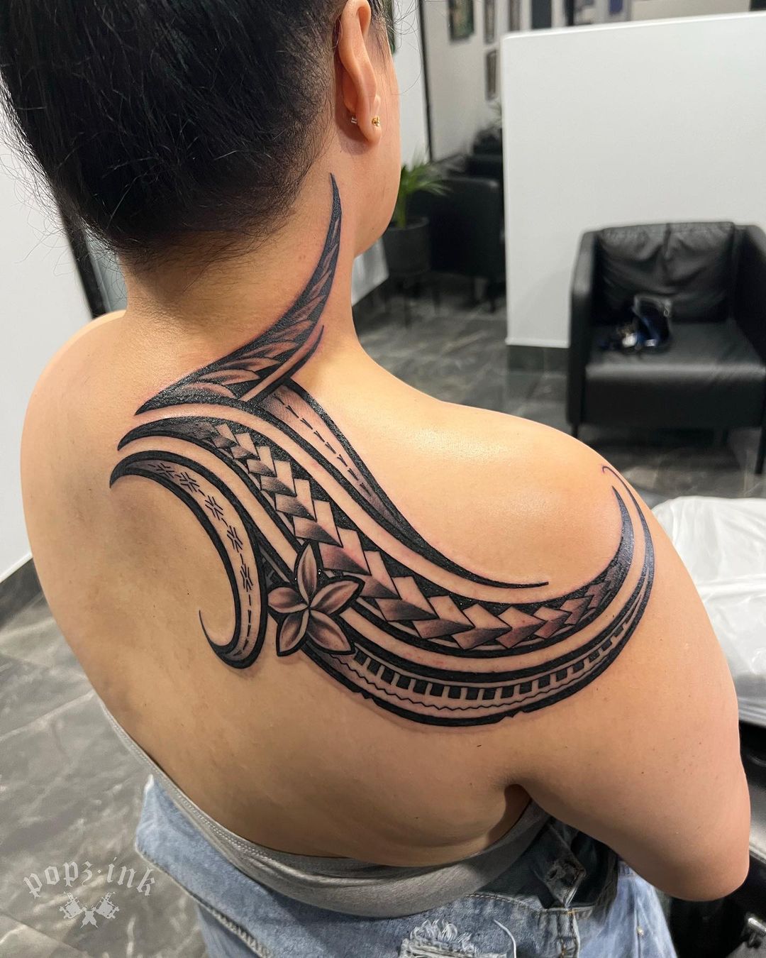 Samoan Shoulder And Back Tattoo With A Floral Touch