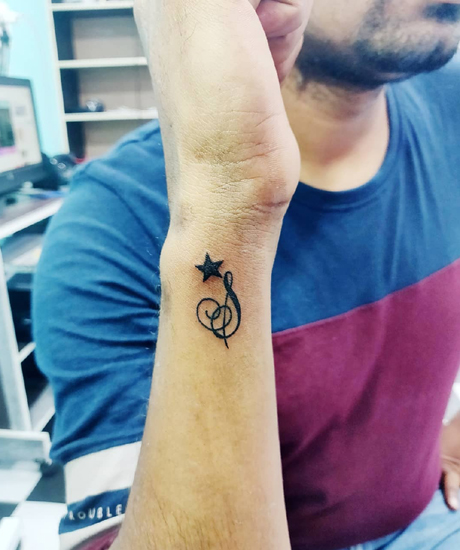 Star S Design Tattoo Near The Wrist