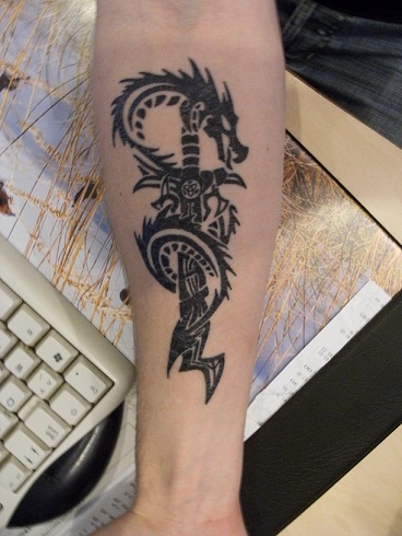 Sword dragon tribal tattoo