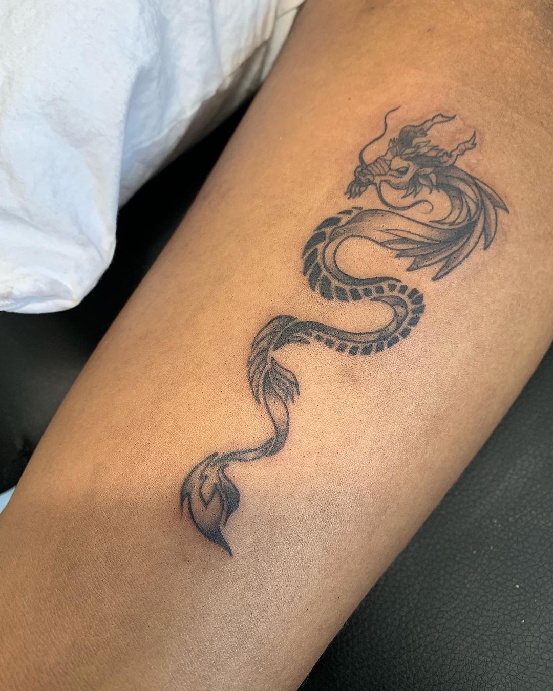 Tribal Dragon Thigh Tattoo