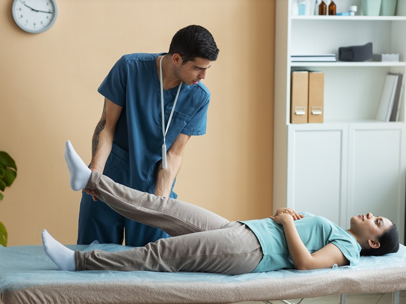 Doctor Helping Patient Rehabilitation
