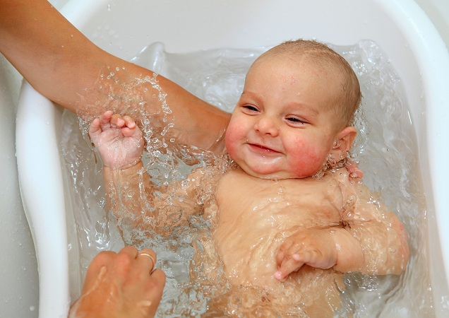Cute,baby,boy,enjoying,bath,,laughing,while,splashing,water