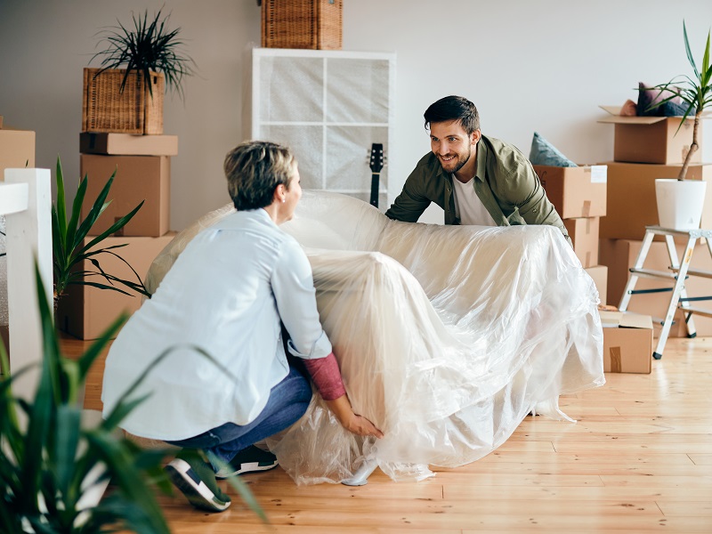 Happy Couple Moving Into Their New Apartment.
